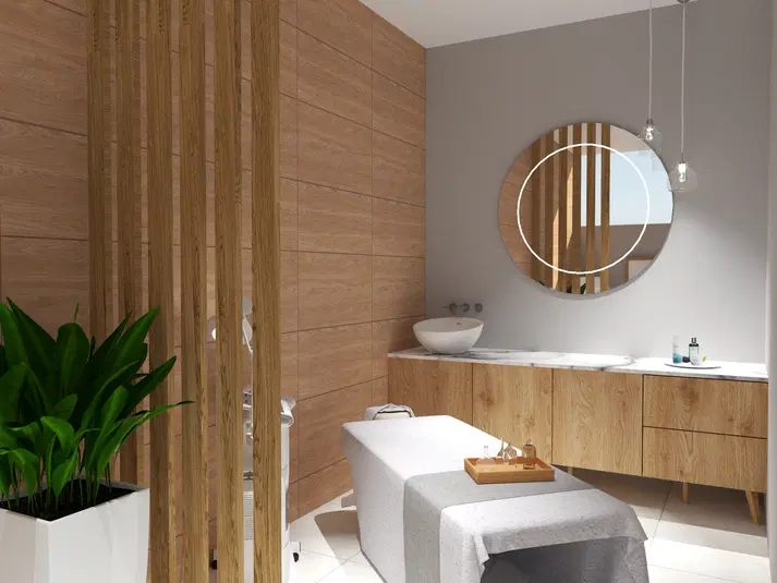  Nowoczesne wnętrze spa z drewnianymi elementami, łóżkiem do masażu, okrągłym lustrem i rośliną w doniczce, minimalistyczny design. 